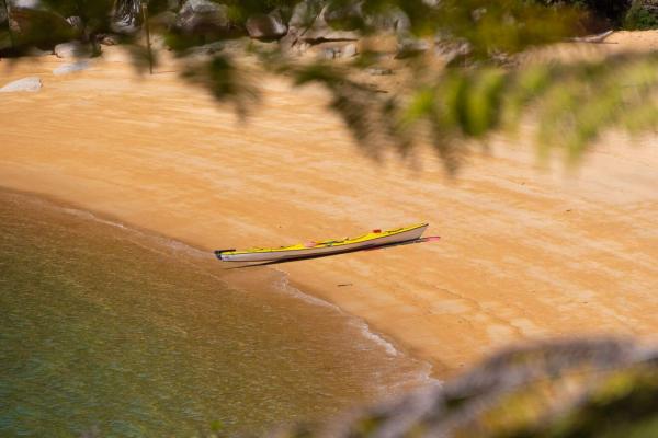 Kayak on the beach Abel Tasman National Park by Bare Kiwi