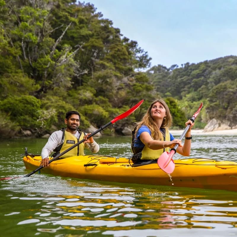 Couple kayaking by Abel Tasman Kayaks