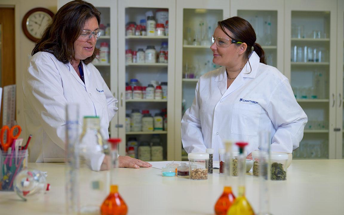 Cawthron Laboratories Technicians With Samples On Desk 1200x720px