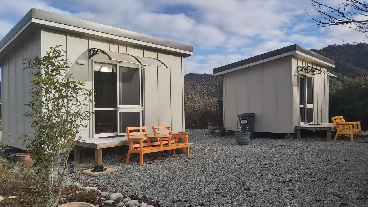 Purpose-built cabins, all supplied with linen and towels.  Guests are welcome to use the site facilities for bathrooms, cooking and recreation. 