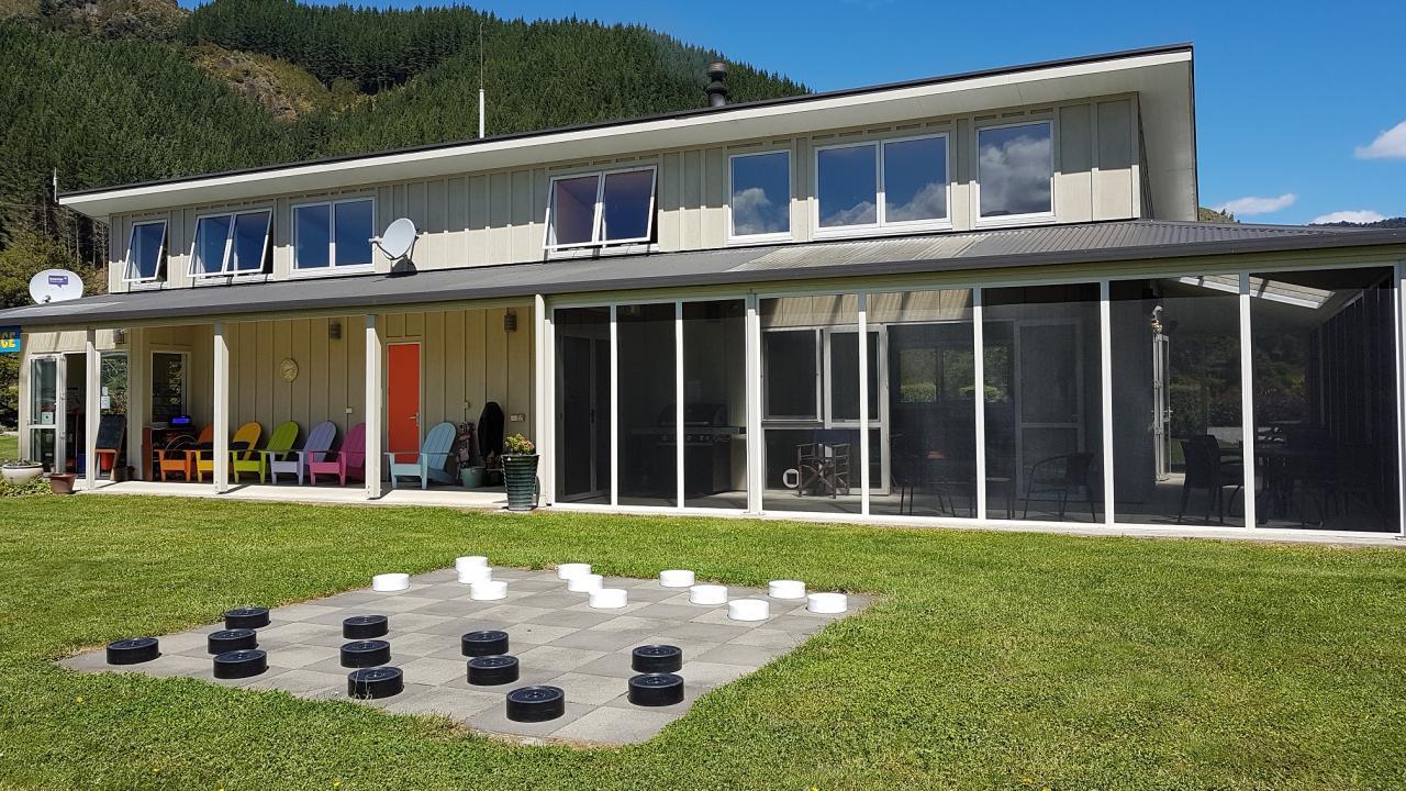 Main block with screened area for outside seating in the evening.  BBQ area next to kitchen area.