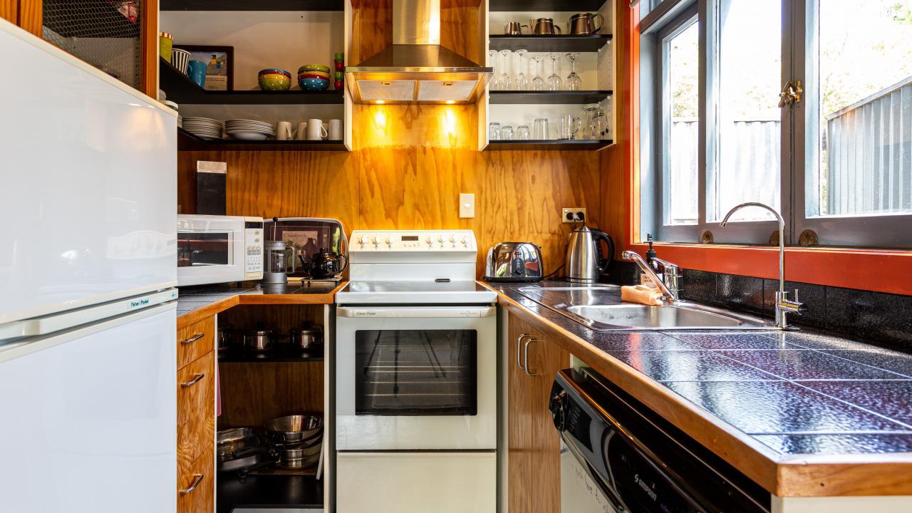 Kitchen. Dishwasher, stove, microwave and fridge.