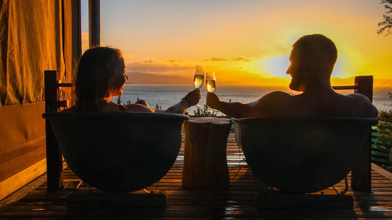 Guests enjoy a sunset bath at Tent Korimako.