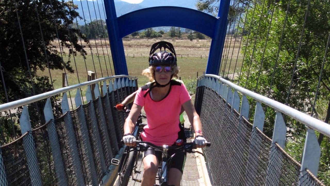 Crossing the Waimea River Suspension bridge on the Great Taste Trail