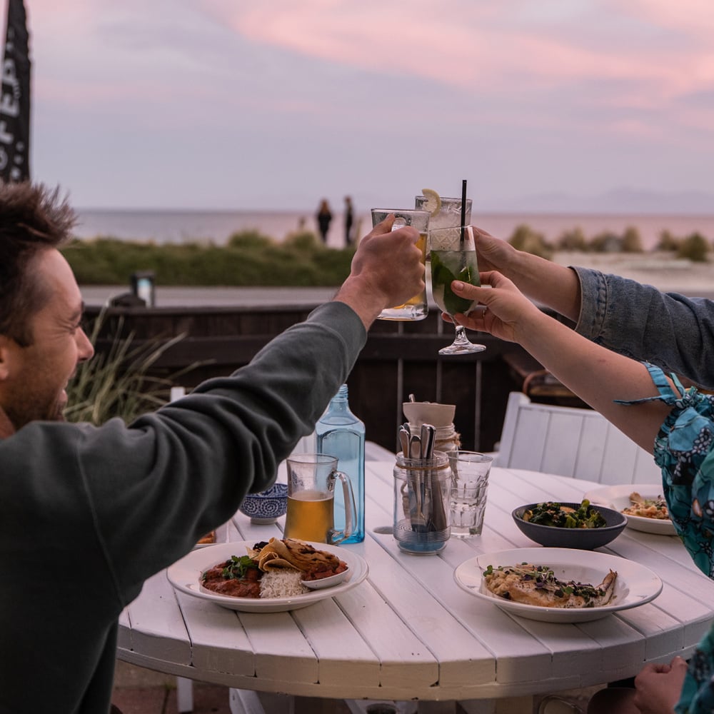 Tuck into fresh, local seafood at Hooked on Mārahau, a relaxed beachfront eatery with unbeatable views of the Abel Tasman coastline.
