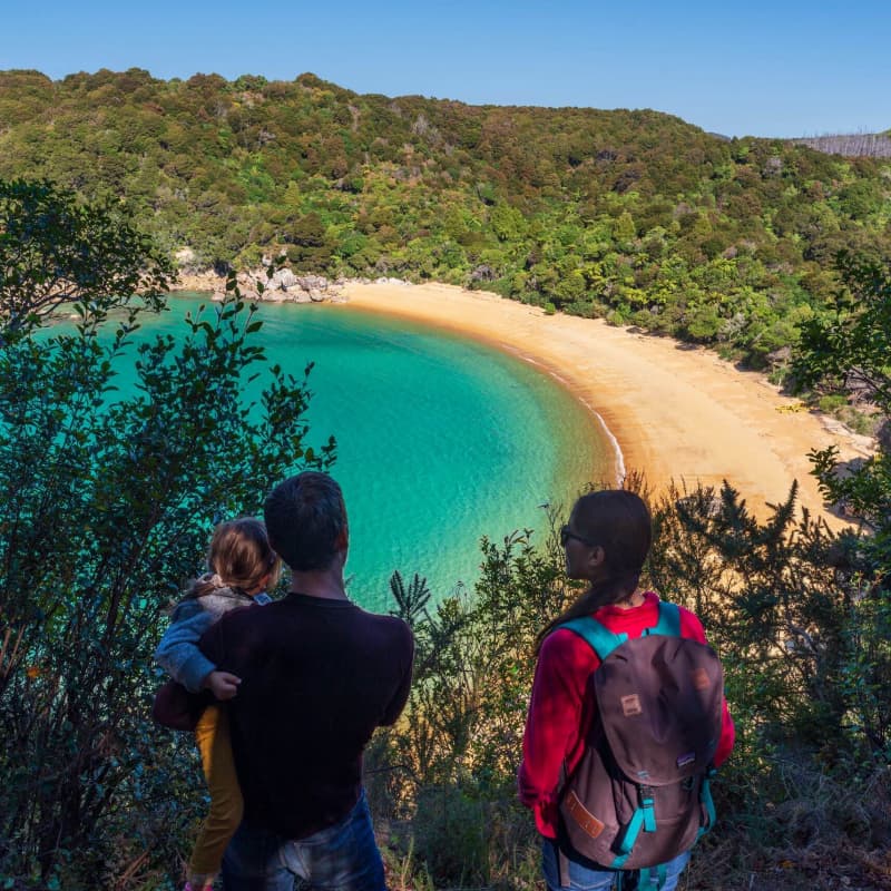 Family walking Abel Tasman National Park
